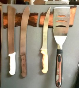 knives hanging from magnetic wooden block