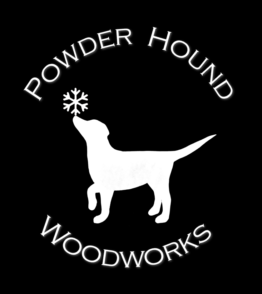 logo powder hound woodworks with white silhouette dog with snowflake on nose